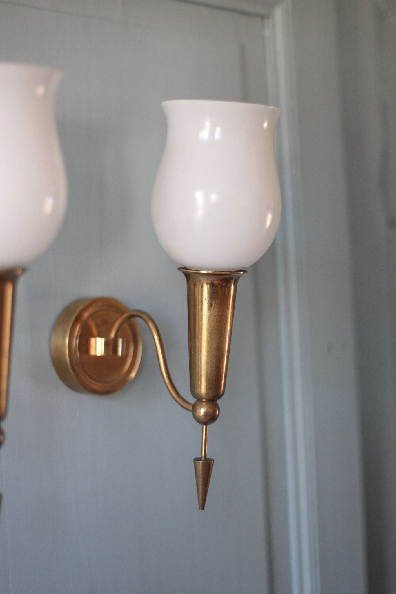 Pair of gold metal and white opaline wall sconces, wall light, sconce.