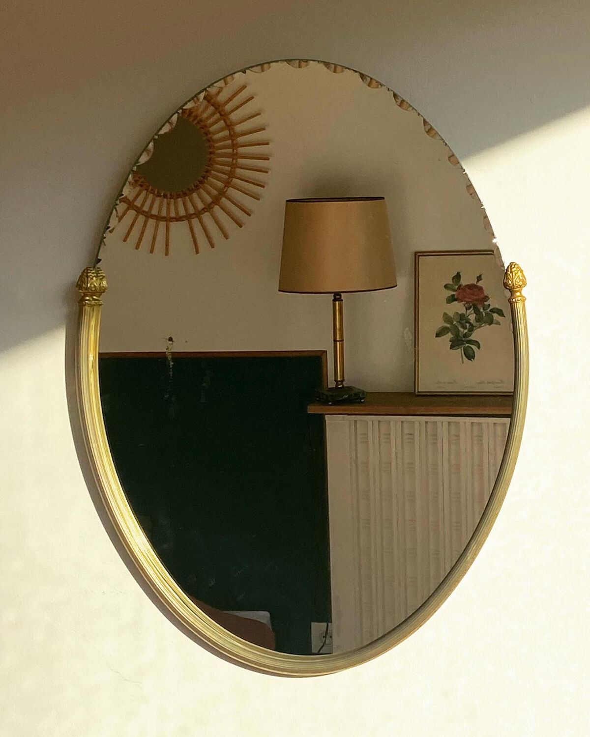 Beveled wall mirror with gold frame