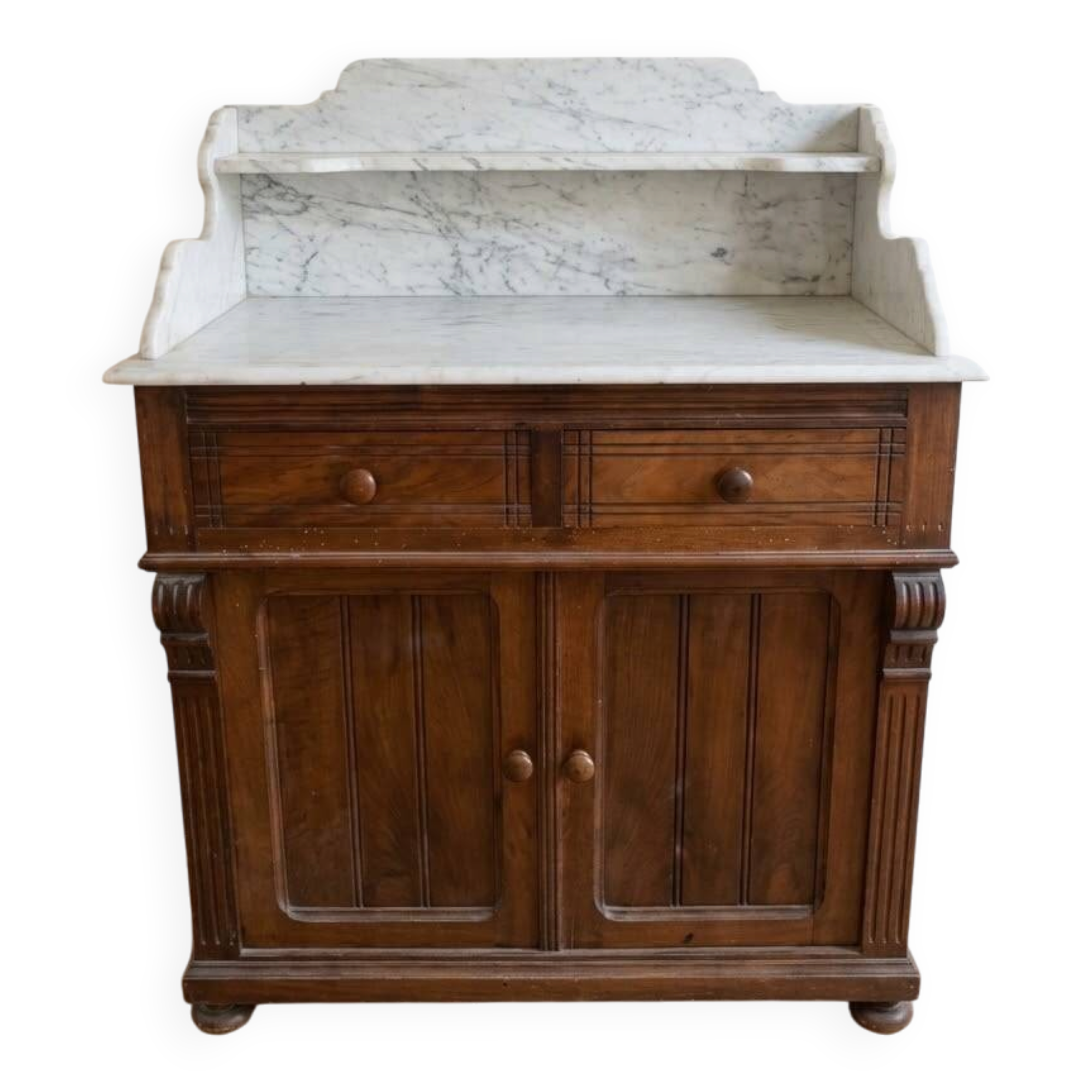 Antique wooden chest of drawers with a marble top.