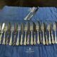 Set of 12 knives and 12 forks by Mappin and Webb in silver-plated metal.