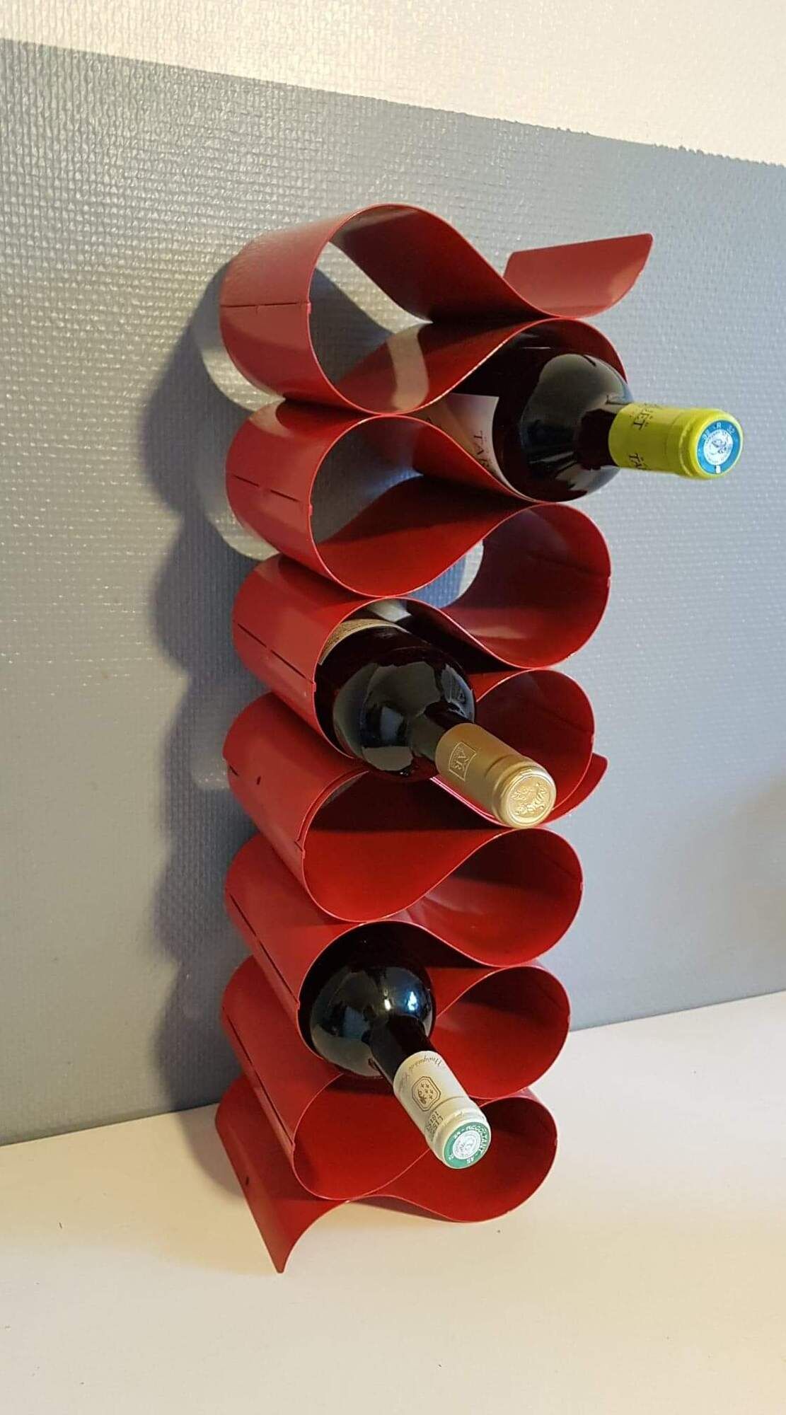 Pair of red metal bottle holders from the 80s