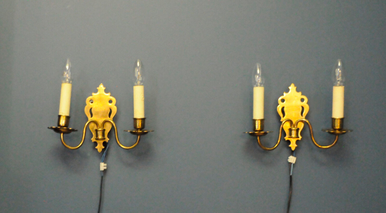 Pair of brass wall sconces by Schroder & Co