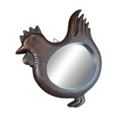 Vintage carved wooden chicken-shaped wall mirror.