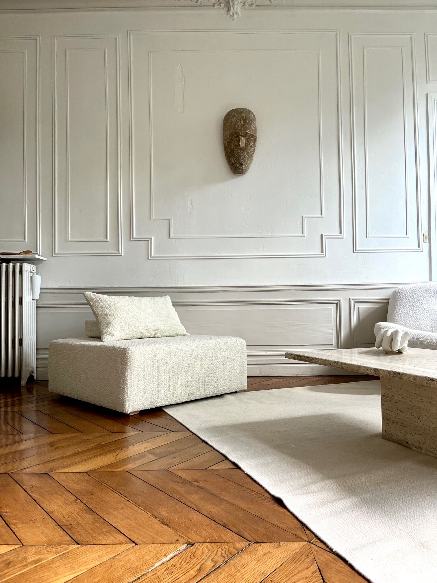 Square ottoman and its cushions in buckle fabric