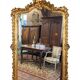 Miroir style Louis XV doré à la feuille d'or du XIXème, 181cm H