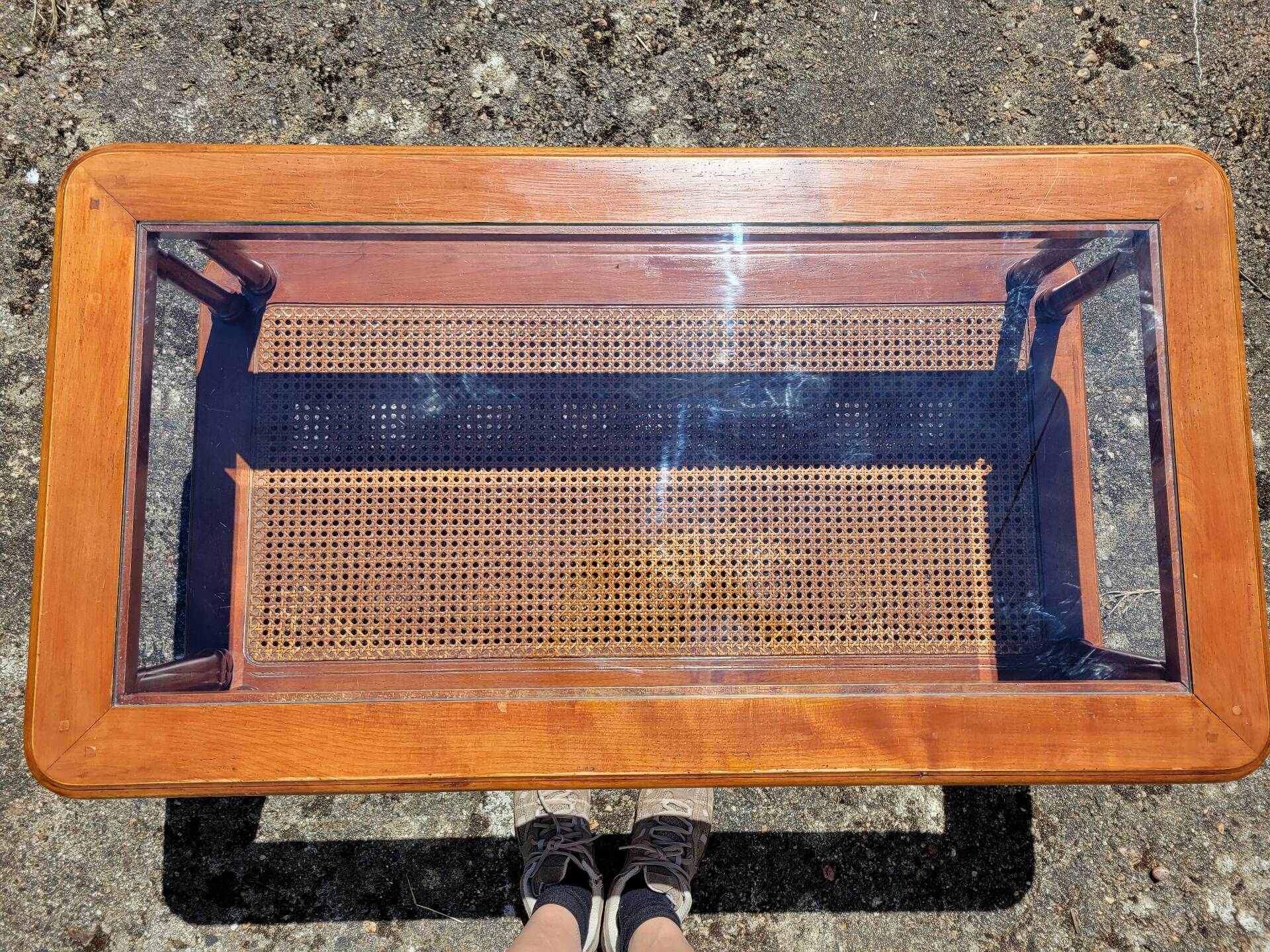 Coffee table in cherry wood, glass and caning.