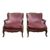 Paire de fauteuils - bergères de style Louis XV en velours rose