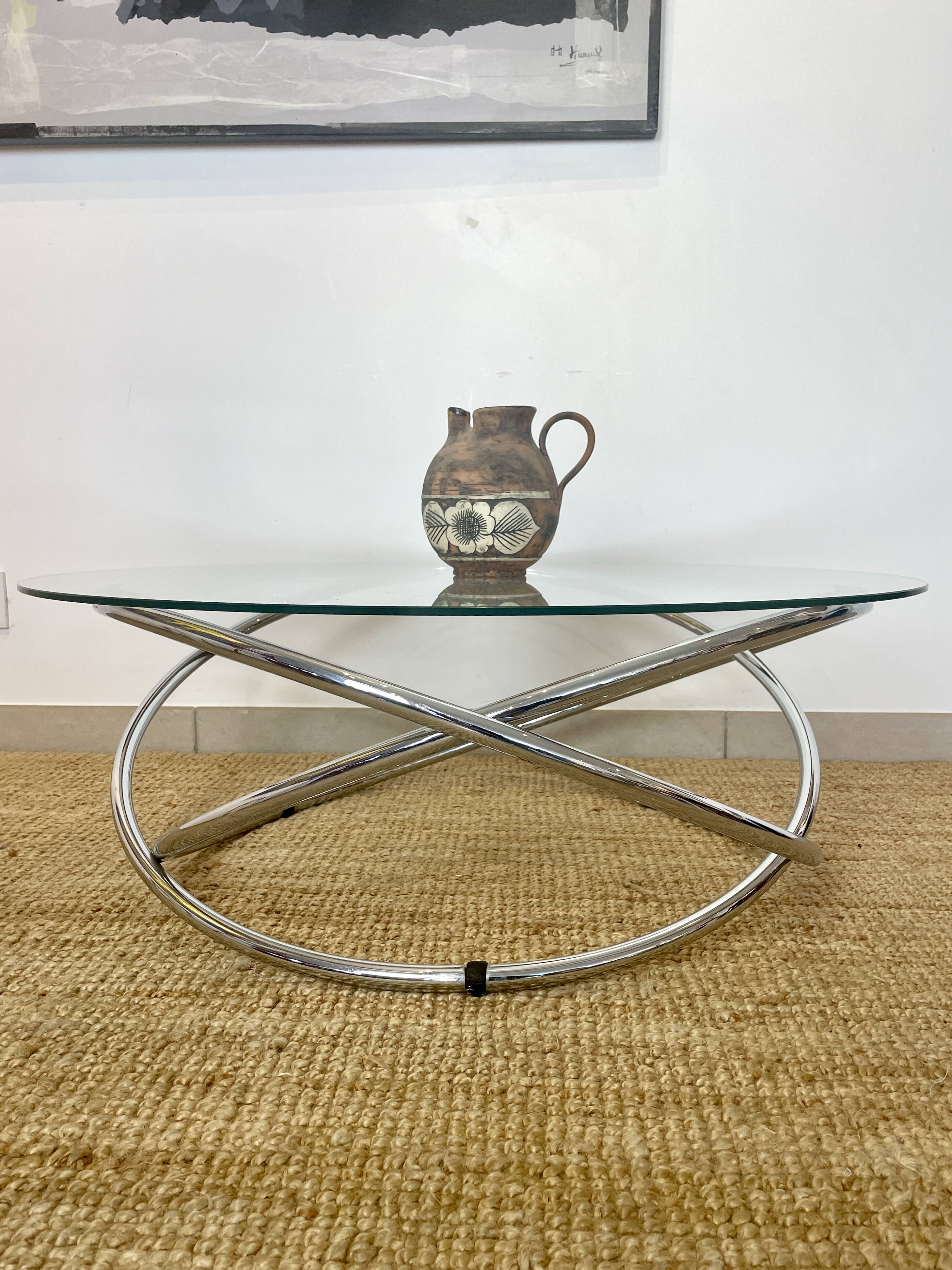 Coffee table with glass top and chrome tubular base