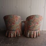 pair of toad armchairs in floral fabric.