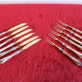 Set of knives and forks for fruits.