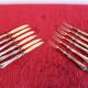 Set of knives and forks for fruits.