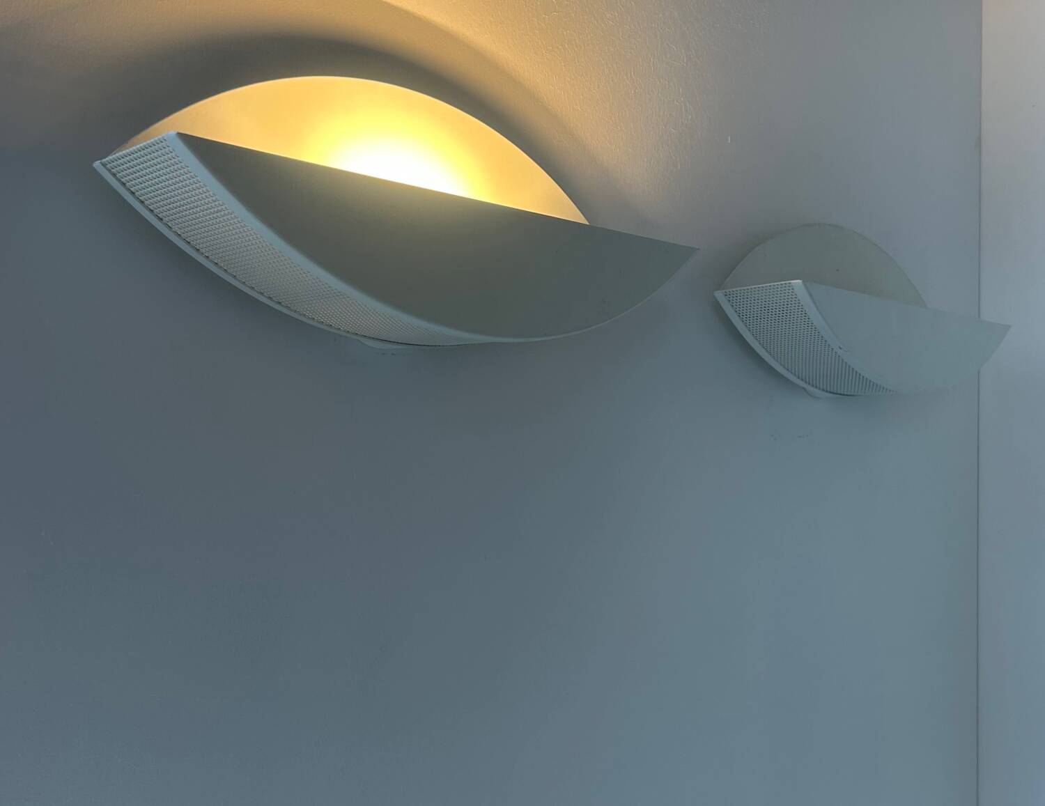 Pair of vintage white perforated metal wall lights, France 1980