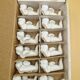 12 porte-couteaux vintage en porcelaine figurant des chérubins