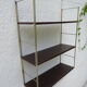 Metal string modular wall shelf