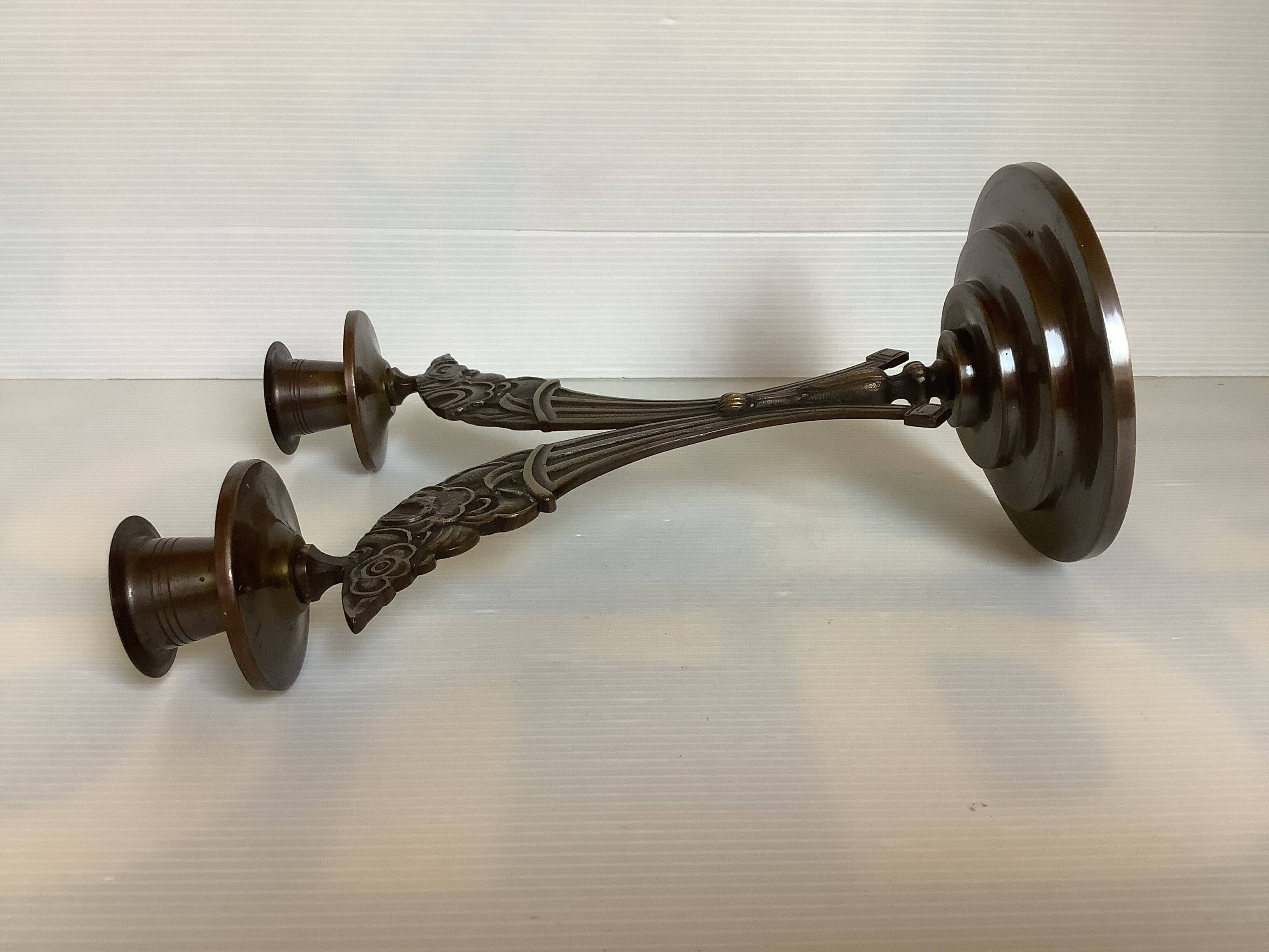 Candle holders in the shape of art deco butterfly wings