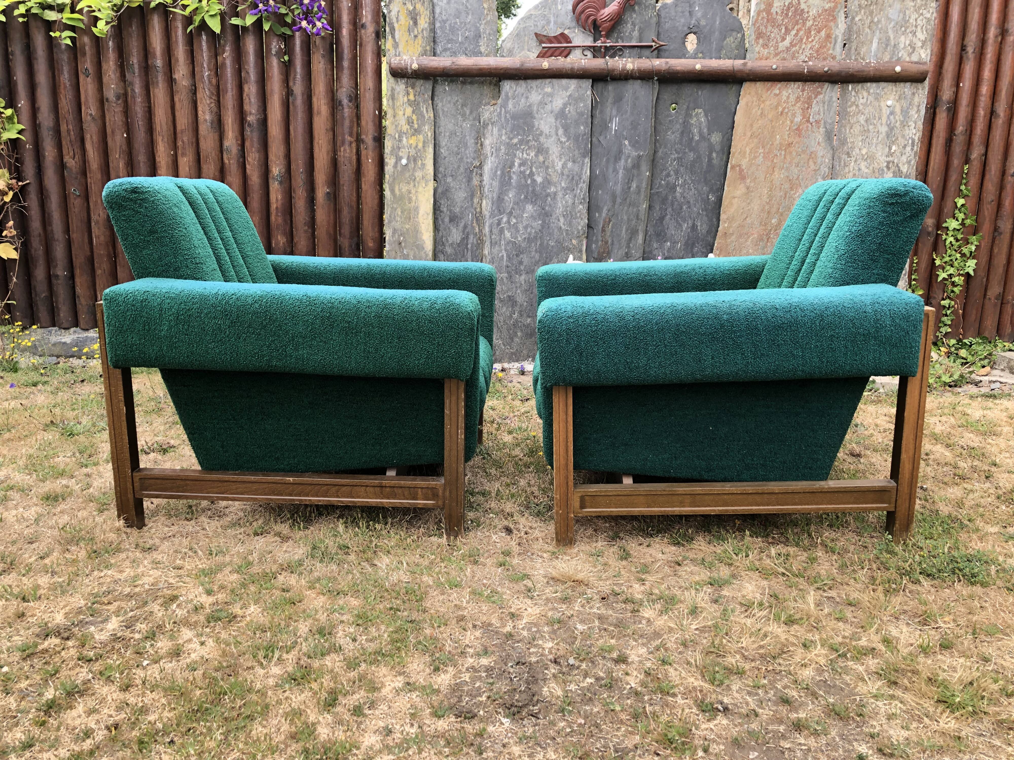 Duo of vintage armchairs with green fabrics.