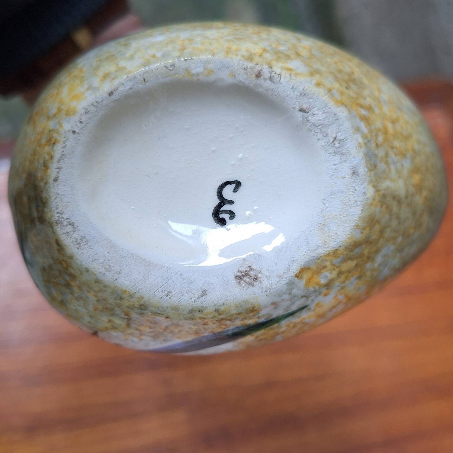 Earthenware vase signed by Jacqueline Gelb with a thistle decoration.