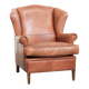 Light cognac-coloured cow leather wingback armchair with matching piping