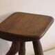 Patinated tripod stool in solid wood from the 1960s.