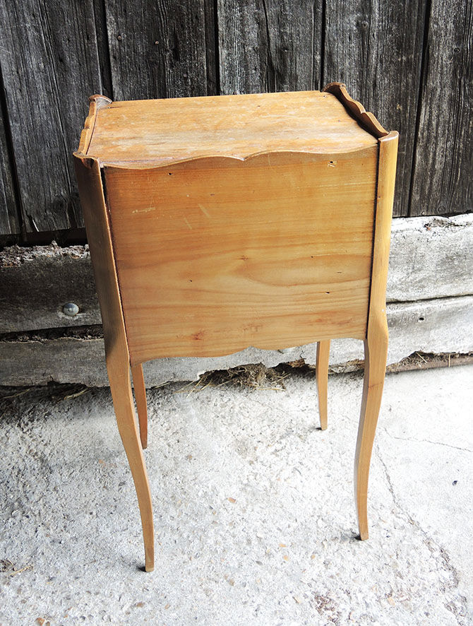 Old wooden bedside table heart pattern