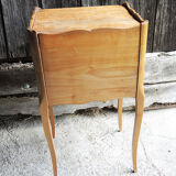 Old wooden bedside table heart pattern