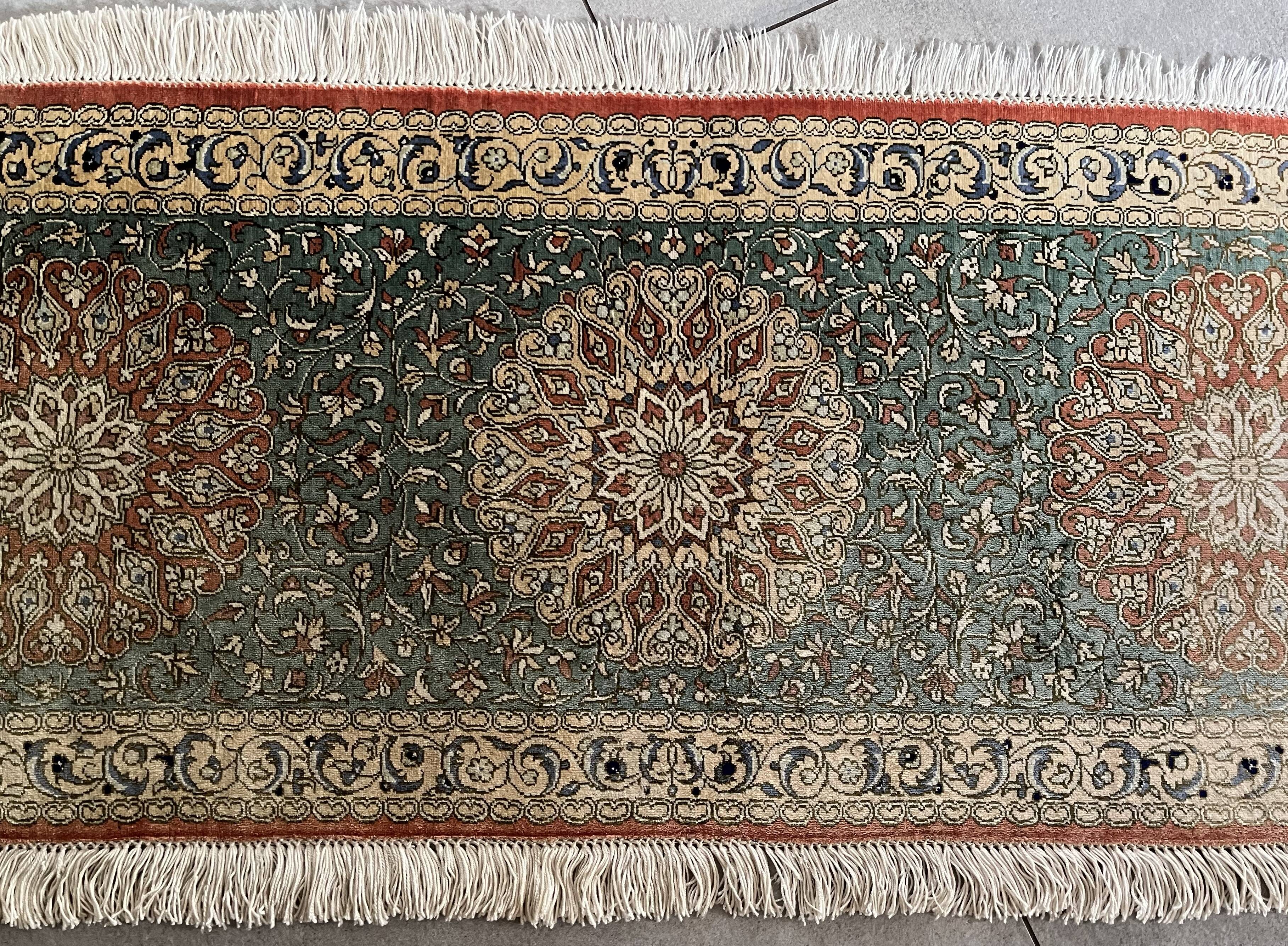 Sino Hereke oval silk rug