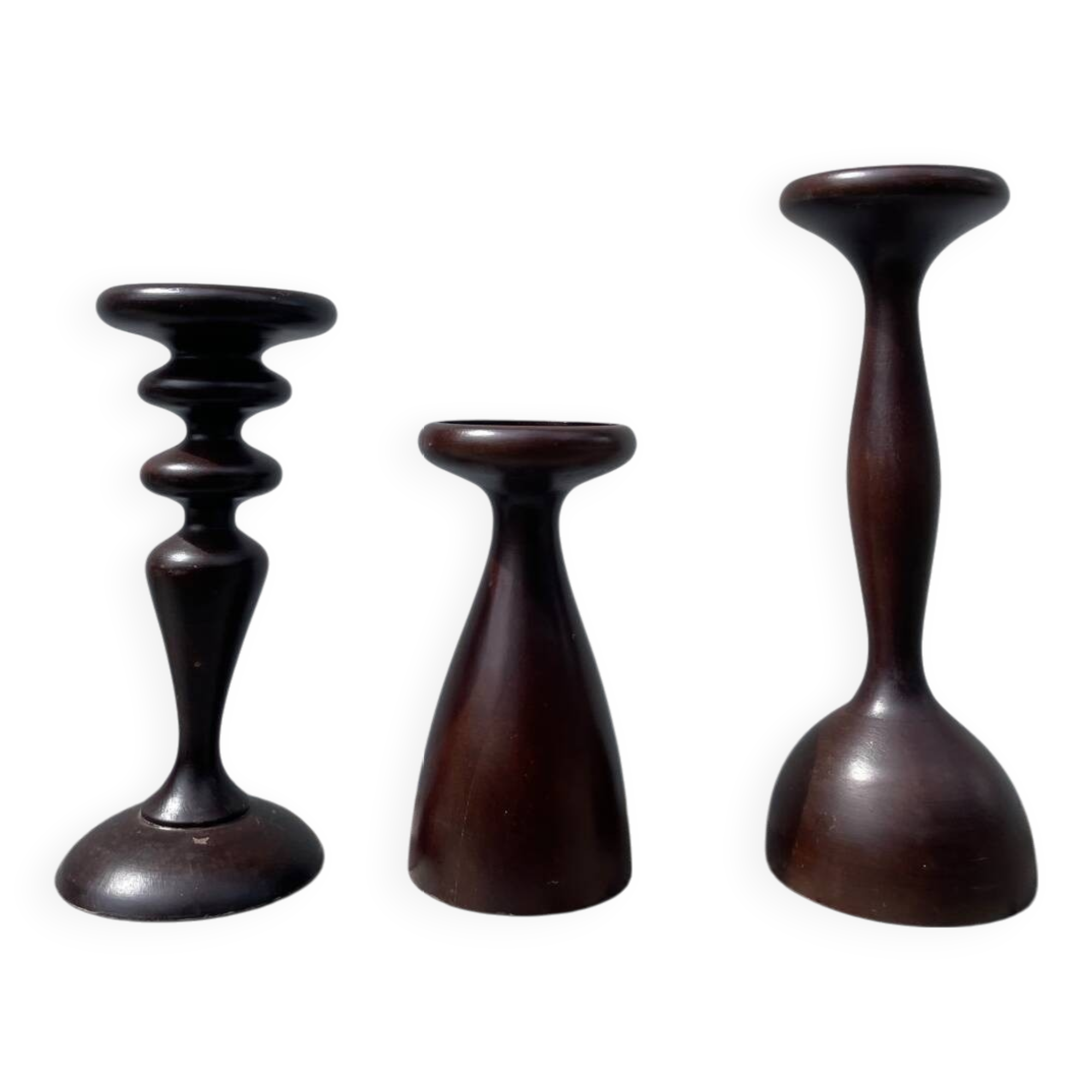Trio of large turned wooden candlesticks