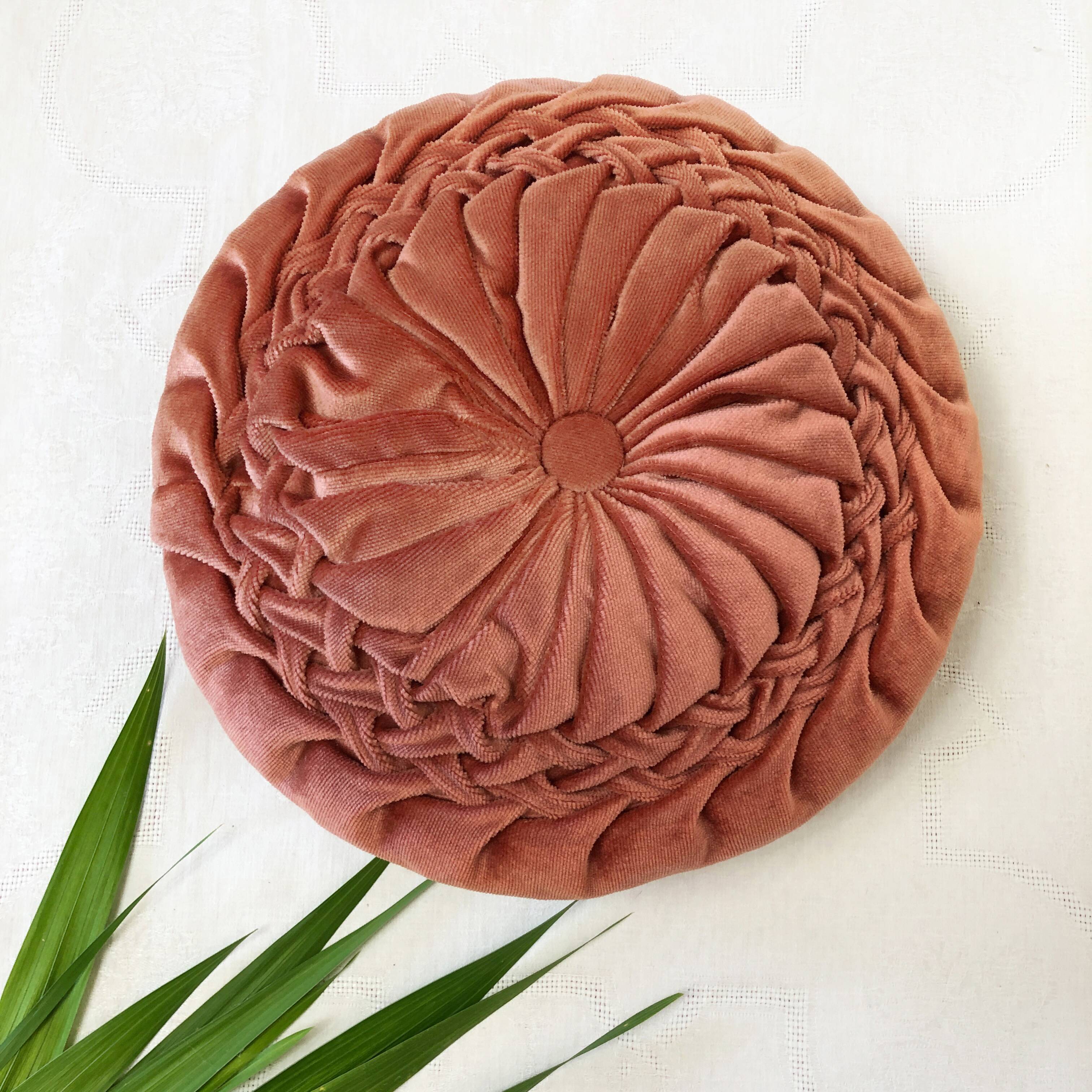 Round orange velvet cushion