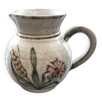 Signed pitcher with thistle decoration