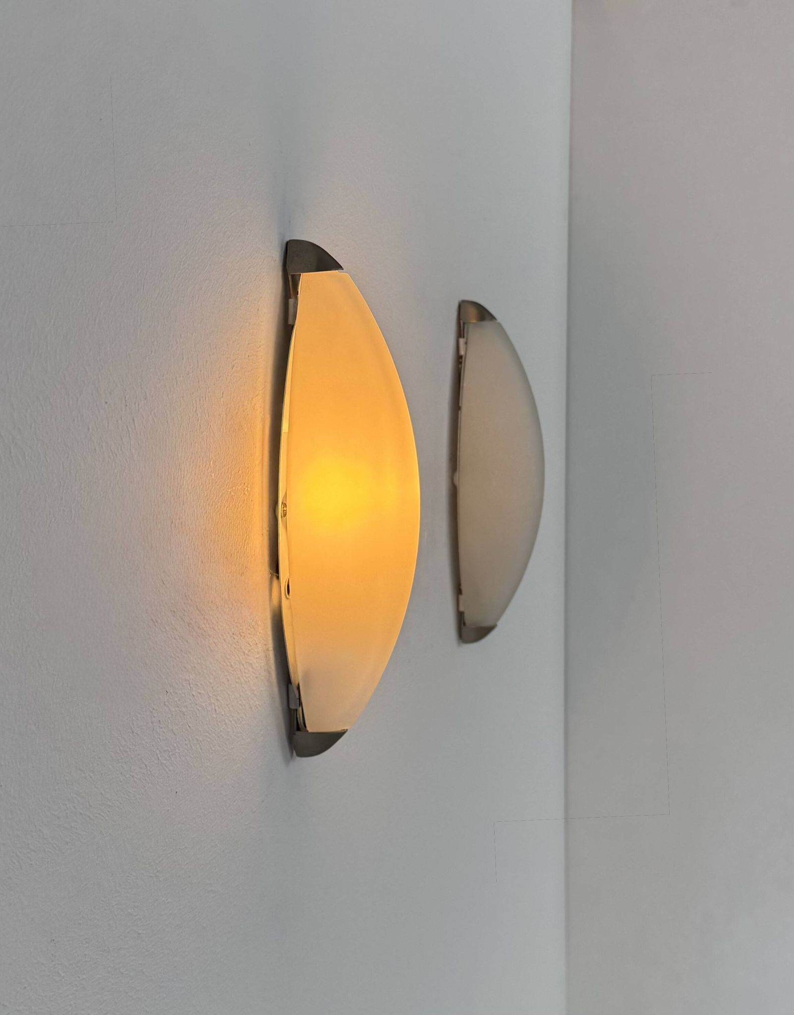 Vintage wall lights, chrome metal and frosted glass, France, 1970.