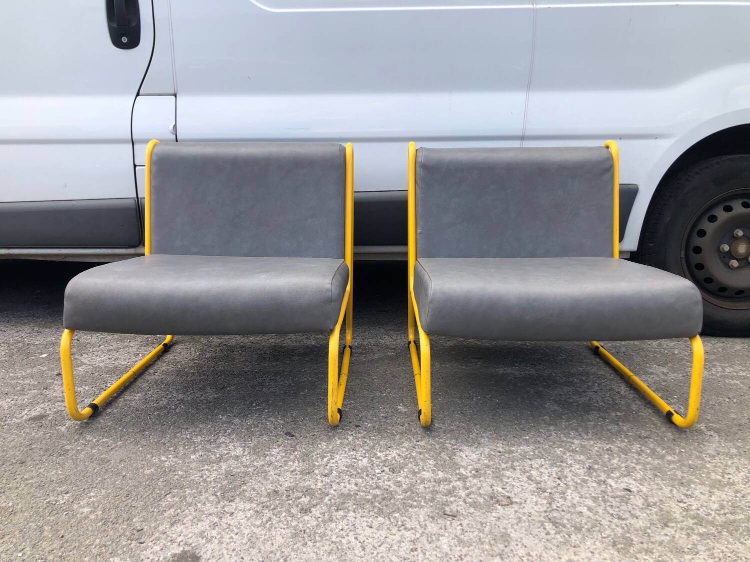 Pair of designer armchairs by Henri Julien