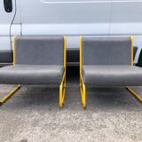 Pair of designer armchairs by Henri Julien