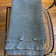 Blue crocheted bedspread and its vintage cushion