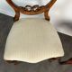 Pair of Victorian English chairs known as balloon chairs in solid mahogany.