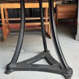Industrial table with cast iron legs and teak top