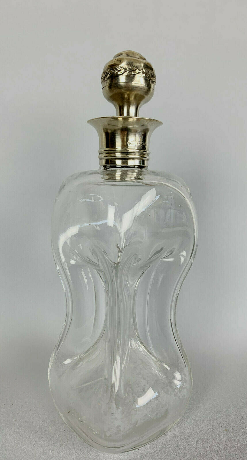 Blown glass carafe with silver frame and cap