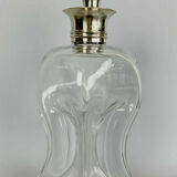 Blown glass carafe with silver frame and cap