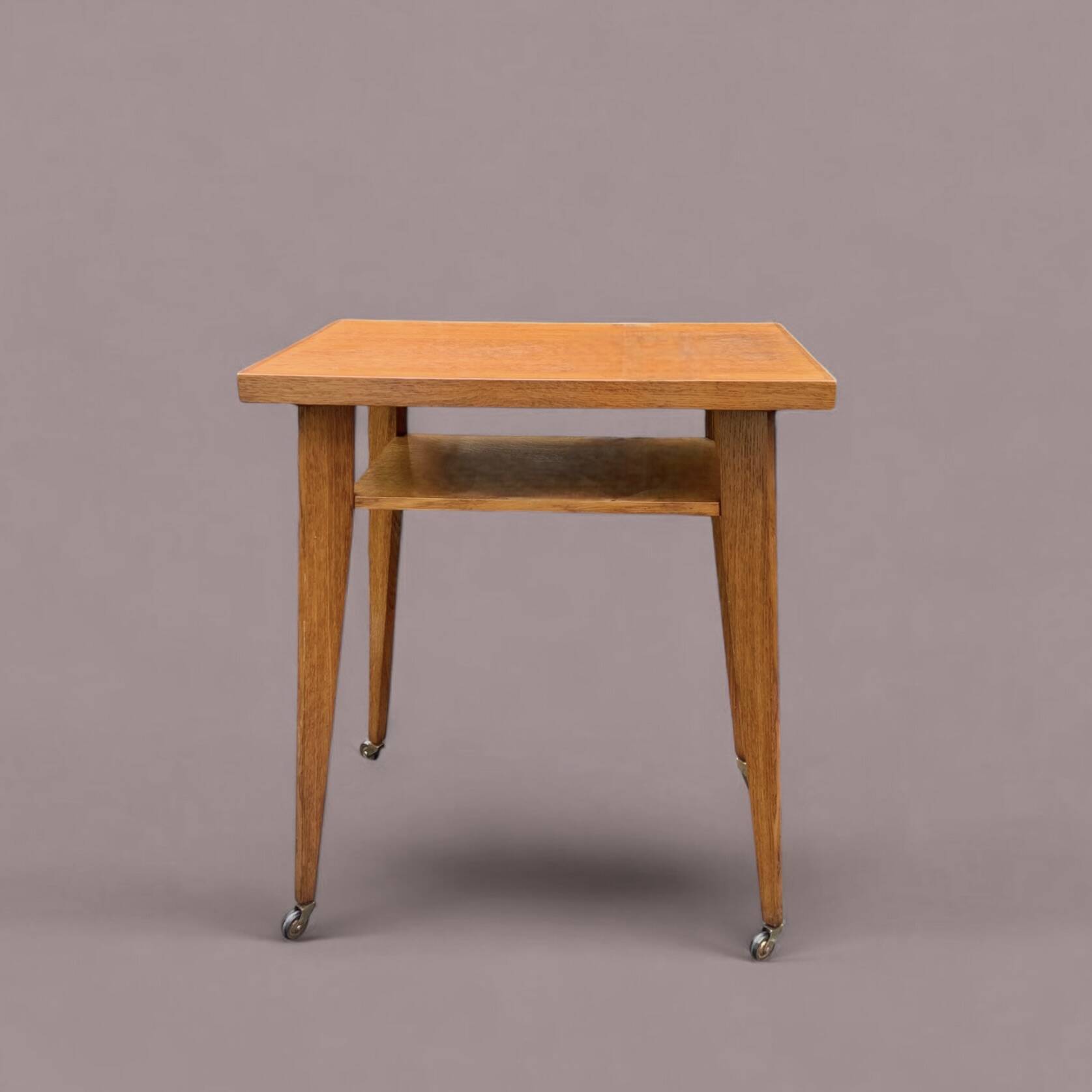 Varnished wooden trolley on wheels