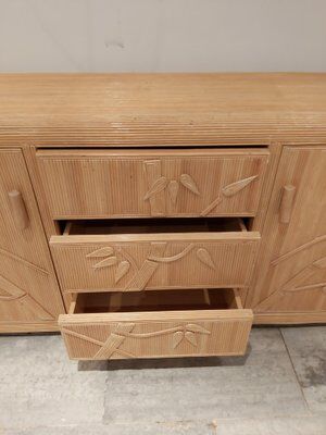 Vintage wicker sideboard with flowers