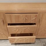 Vintage wicker sideboard with flowers