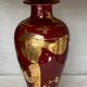 Vintage 1970 red and gold ceramic lamp with oriental decorations.