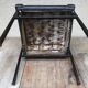 Ancien fauteuil structure métal noir et skaï noir