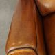 Set of 2 very comfortable large sheepskin armchairs elegantly finished with black piping