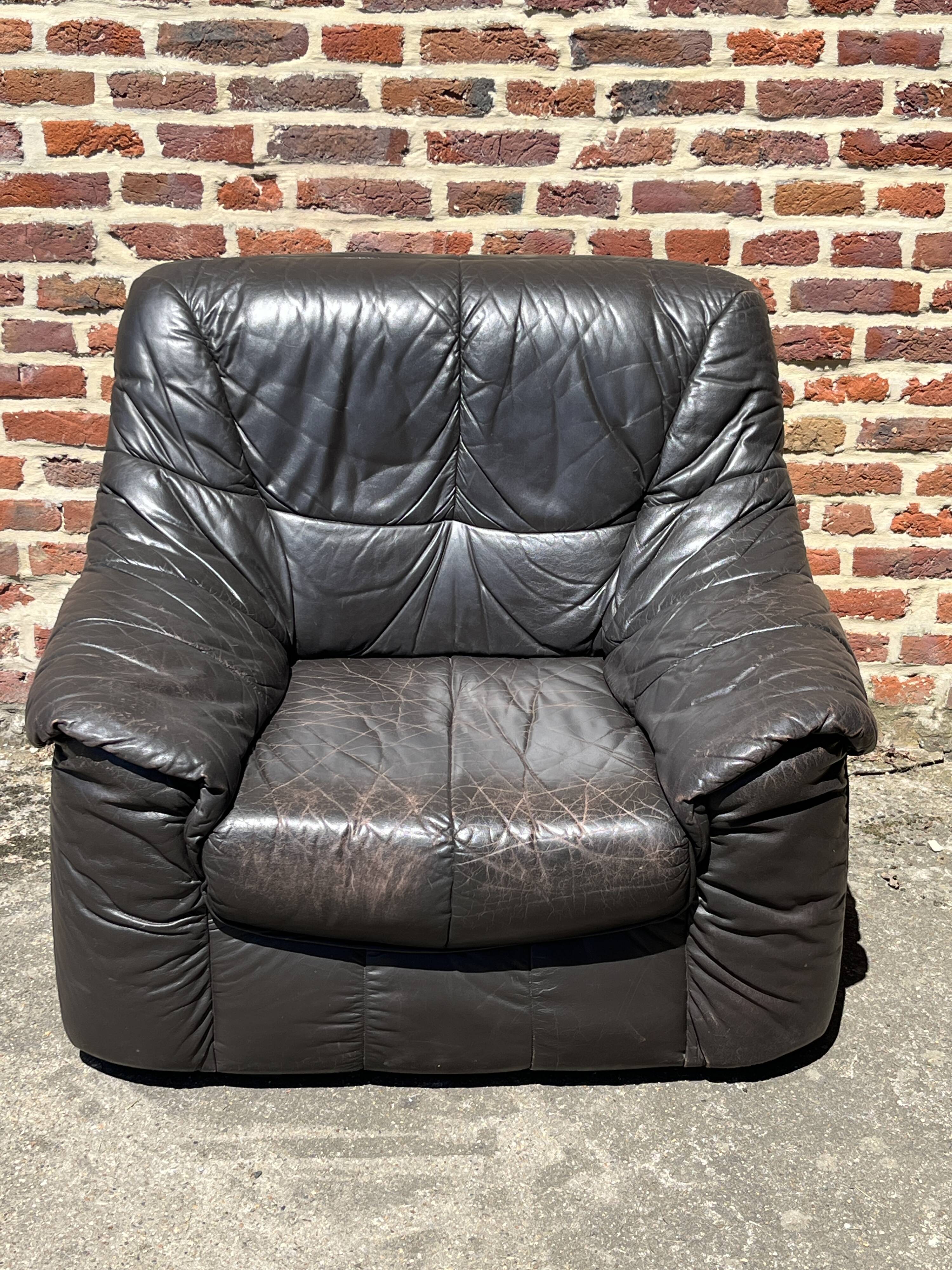Pair of patinated leather club armchairs
