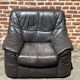 Pair of patinated leather club armchairs
