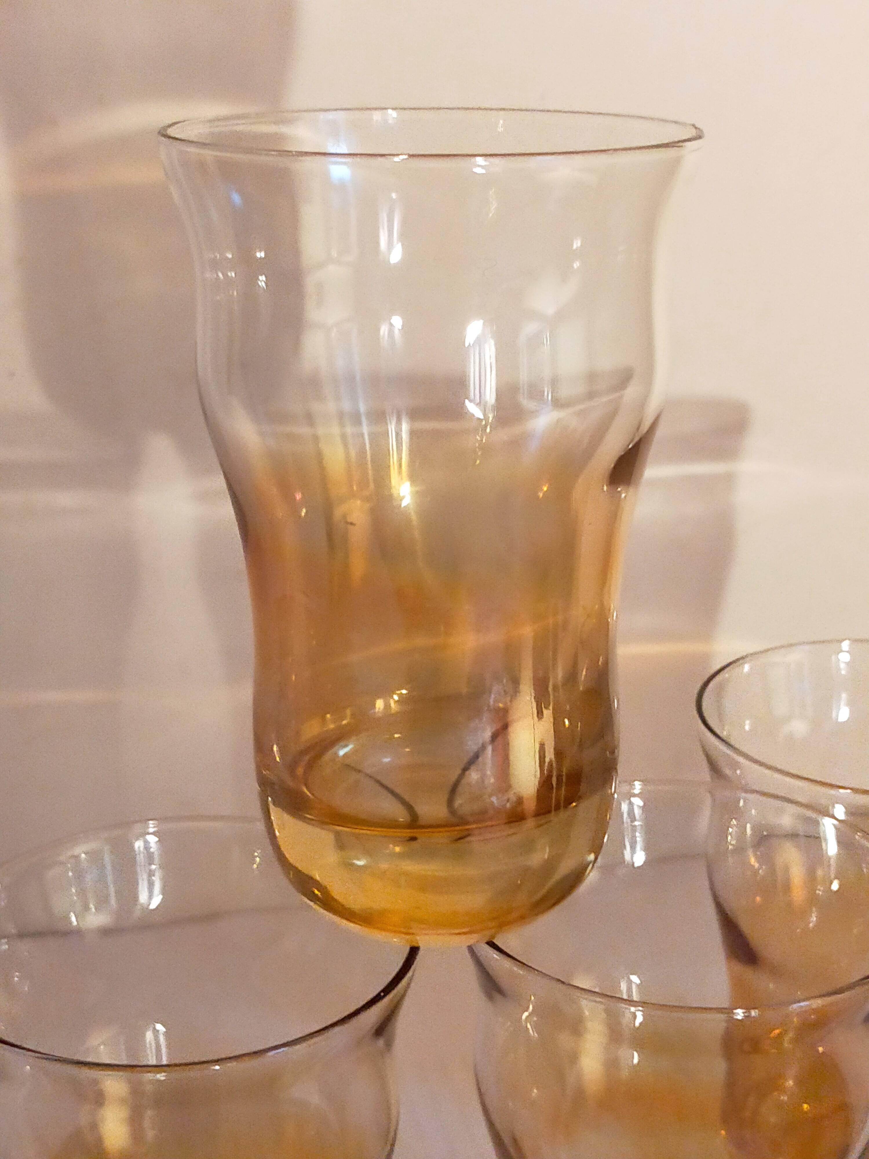 Four iridescent honey blown glass glasses