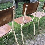 Three vintage school chairs