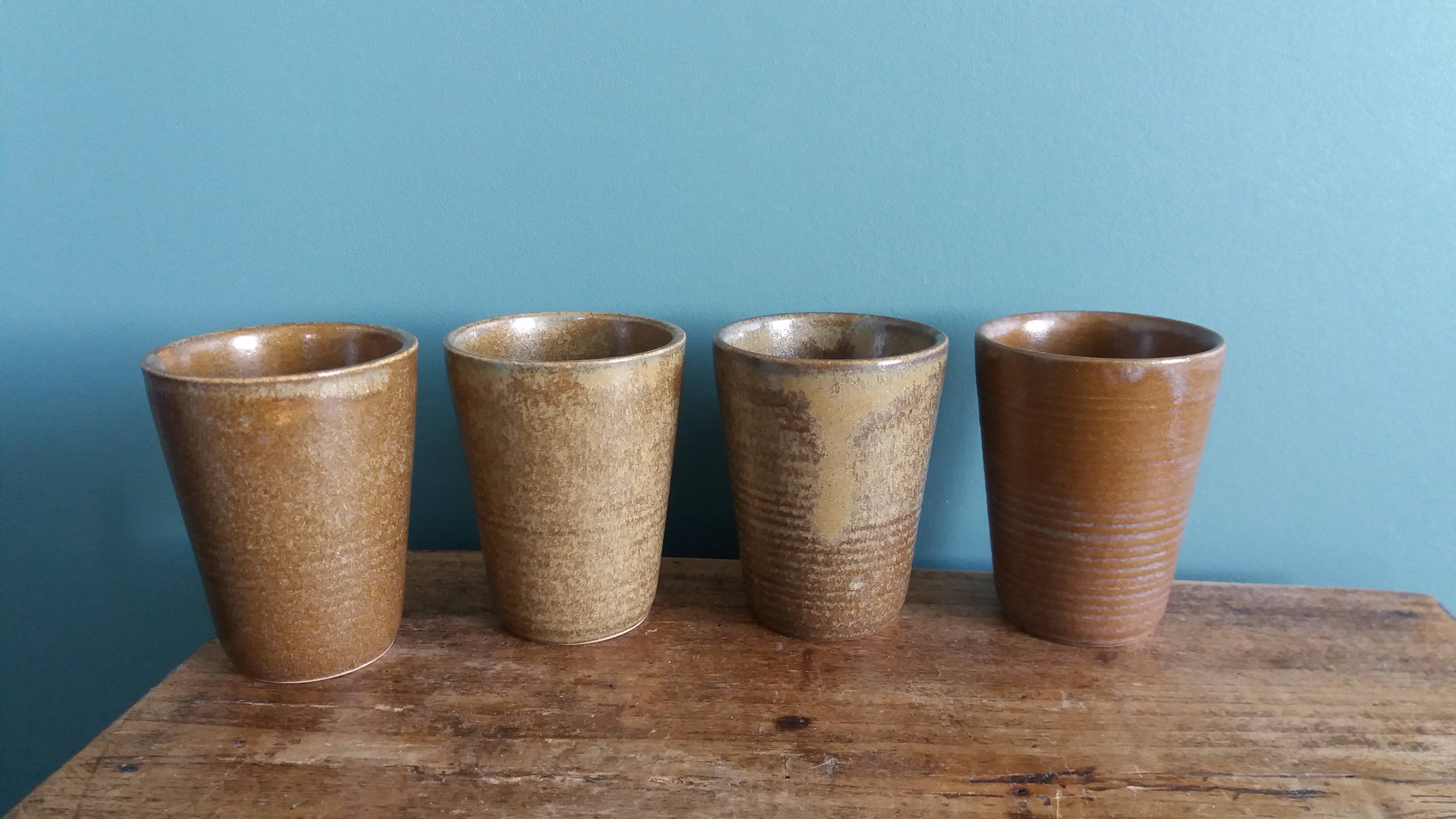 Digoin stoneware mugs, glasses, and cups.