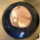 Blue rounded vase with floral details