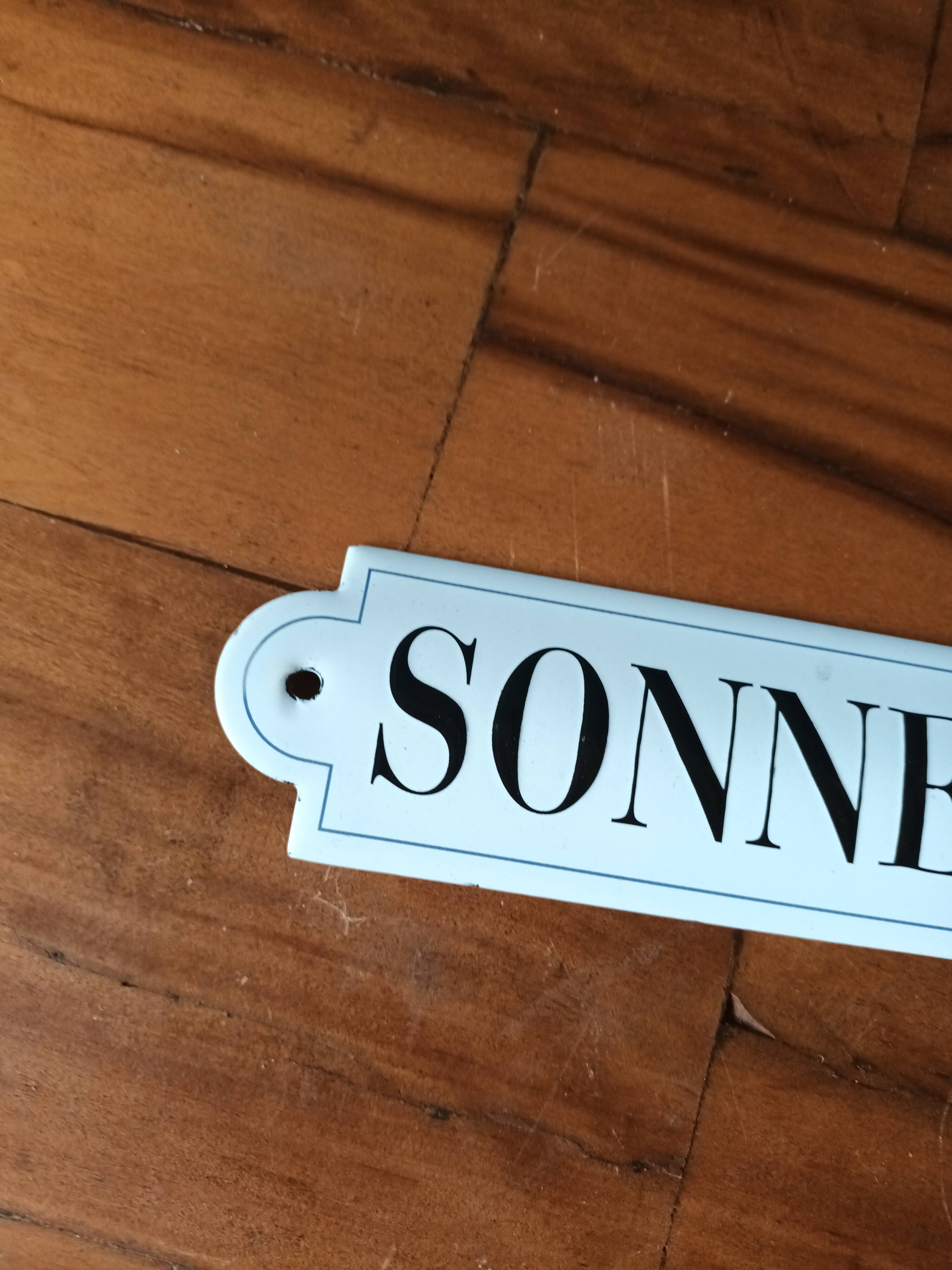 Doorbell enamel plate